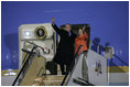 President George W. Bush and Laura Bush wave from Air Force One Tuesday, Nov. 15, 2005, after arriving at Osaka International Airport in Osaka, Japan.