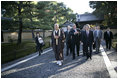 President George W. Bush and Japan’s Prime Minister Junichiro Koizumi join the Reverend Raitei Arima, Chief Priest of the Golden Pavilion Kinkakuji Temple in Kyoto, Japan, Wednesday, Nov. 16, 2005.