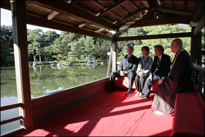 President George W. Bush, Mrs. Bush, Japan’s Prime Minister Junichiro Koizumi and the Reverend Raitei Arima, Chief Priest of the Golden Pavilion Kinkakuji Temple, pause during a cultural visit to the temple Wednesday, Nov. 16, 2005, in Kyoto.