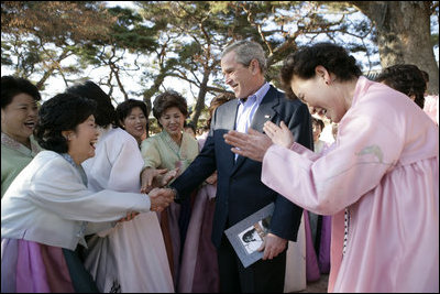 President George W. Bush greets excited participants Thursday, Nov. 17, 2005, during his tour of the Bulguksa Temple in Gyeongju, Korea.