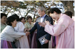 President George W. Bush greets excited participants Thursday, Nov. 17, 2005, during his tour of the Bulguksa Temple in Gyeongju, Korea.