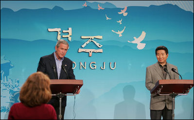 President George W. Bush and Moo Hyun Roh, President of the Republic of Korea, listen to a question from a reporter Thursday, Nov. 17, 2005, during a joint press availability at the Hotel Hyundai in Gyeongju, Korea.