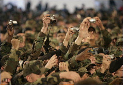 A sea of cameras and hands greet President Bush upon his arrival Saturday, Nov. 19, 2005, to Osan Air Base in Osan, Korea.