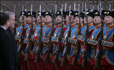 President Bush and Mongolia President Nambaryn Enkhbayar review Mongolia troops Monday, Nov. 21, 2005, as President and Mrs. Bush arrived in Ulaanbaatar on the final stop of their 7-day Asia trip. 