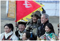 President George W. Bush poses for photos with a Mongolia horseman and other participants of a cultural event in Ikh Tenger, near the capital city of Ulaanbaatar, during a visit Monday, Nov. 21, 2005, by the President and Mrs. Bush. 