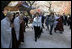 President George W. Bush and Laura Bush smile as they are greeted by monks Thursday, Nov. 17, 2005, at the Bulguksa Temple in Gyeongju, Korea.