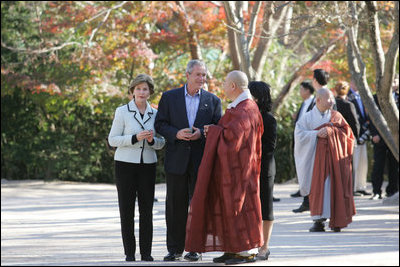 President George W. Bush and Laura Bush are welcomed to Bulguksa Temple by Juji Sunim, the chief monk, during their visit Thursday, Nov. 17, 2005, to Gyeongju, Korea.