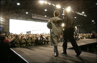 President George W. Bush and Laura Bush enter the Black Cat Hangar at Osan Air Base in Osan, Korea Saturday, Nov. 19, 2005, where the President made remarks to the troops before continuing his Asia tour.