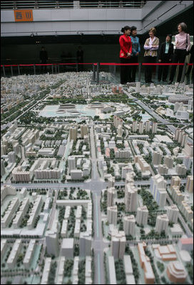 A model of the future Beijing sits in the foreground as Mrs. Bush and Sarah Randt, wife of the U.S. Ambassador to China, tour the Beijing Urban Planning Museum Sunday, Nov. 20, 2005, in Beijing.