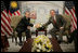 President George W. Bush and Prime Minister Abdullah Ahmad Badawi of Malaysia, exchange handshakes during their meeting Thursday, Nov. 17, 2005, at the Chosun Westin Hotel in Busan, Korea.