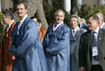 President George W. Bush peaks out behind Mexico President Vincente Fox, left, with Japan's Prime Minister Junichiro Koizumi as APEC leaders walk to the official photograph site Saturday, Nov. 19, 2005, at the Nurimaru APEC House in Busan, Korea.