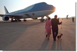 President and Mrs. Bush board Air Force One with Spotty. White House photo by Eric Draper.