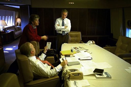 President George W. Bush meets with Karen Hughes and Karl Rove in the conference room aboard Air Force One Nov. 5, 2002. White House photo by Eric Draper.