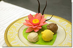 Three ice creams presented on a white chocolate lily pad with a lotus flower. White House Executive Pastry Chef Thaddeus DuBois created for the Official Visit of the Prime Minister of India July 18, 2005. White House photo by Shealah Craighead