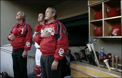President George W. Bush joins the sold-out crowd at RFK Stadium in the singing of the National Anthem Thursday, April 14, 2005, at the home opener of the Washington Nationals.