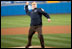 President George W. Bush throws out the first pitch during game three of the World Series game between the Arizona Diamondbacks and the Yankees at Yankee Stadium Oct. 3, 2001.