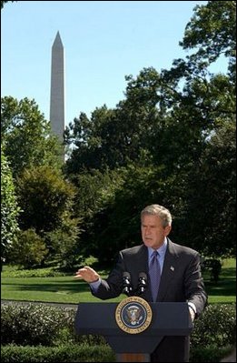 President George W. Bush discusses his Clear Skies Initiative in the East Garden Tuesday, Sept. 16, 2003. The initiative mandates a 70 percent cut in air pollution from power plants over the next 15 years, including the first-ever national cap on mercury emissions. 