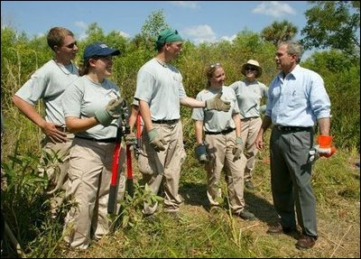 President George W. Bush talks with AmeriCorps volunteers at Rookery Bay National Estuarine Research Reserve in Naples, Fla., Friday, April 22, 2004. 