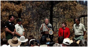 President George W. Bush talks about his Healthy Forests Initiative during a visit to the Coronado National Forest in Summerhaven, Ariz., with, from left, Incident Commander Dan Oltrogge, District Ranger Ron Senn, Secretary of Agriculture Ann Veneman, and Chief of the National Forest Service Dale Bosworth.