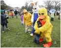 Cold days bring warm hugs as the Easter Bunny and his friends greets young visitors to a soggy South Lawn the 2005 White House Easter Egg Roll.