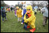 Cold days bring warm hugs as the Easter Bunny and his friends greets young visitors to a soggy South Lawn the 2005 White House Easter Egg Roll.