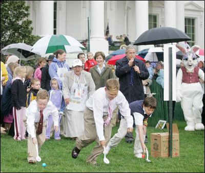 President George W. Bush is joined by Mrs. Laura Bush as he blows a whistle to start the Easter Egg Roll races on the South Lawn of the White House during the 2006 White House Easter Egg Roll, Monday, April 17, 2006. The first White House Easter Egg Roll was held in 1878.