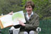 Mrs. Laura Bush reads a story to children attending the 2006 White House Easter Egg Roll, Monday, April 17, 2006 on the South Lawn of the White House.