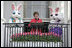 Mrs. Laura Bush addresses South Lawn visitors to the 2007 White House Easter Egg Roll from the Truman Balcony Monday, April 9, 2007. "In Washington, we know spring has arrived when the White House lawn is filled with children for the Easter Egg Roll," said Mrs. Bush. "So thank each one of the children for coming. Thank you for bringing an adult with you." White House photo by Shealah Craighead