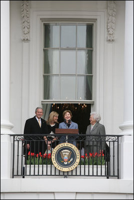 Mrs. Laura Bush, joined by President George W. Bush, daughter, Jenna, and former first lady Barbara Bush, welcomes guests Monday, March 24, 2008 to the South Lawn of the White House, for the 2008 White House Easter Egg Roll.
