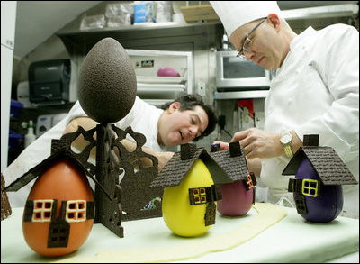 White House pastry chef Bill Yosses, right, and assistant Chris Phillips work on the details of a chocolate egg village Friday, March 21, 2008 in the White House pastry kitchen, for Monday's 2008 White House Easter Egg Roll.