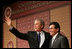 El Presidente George W. Bush, de lado del Fiscal General Alberto Gonzáles, agradece los aplausos después de dirigirse a la Hispanic Chamber of Commerce Legislative Conference el miércoles 20 de abril de 2005 en Washington, D.C.