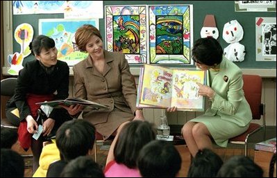 Mrs. Bush and an interpreter listen as Princess Hisako Takamado reads a book she has written, "Katie and the Dream-Eater", to students at Akashi Elementary School, Monday, February, 18, 2001. White House photo by Susan Sterner. 
