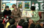 Mrs. Bush and an interpreter listen as Princess Hisako Takamado reads a book she has written, "Katie and the Dream-Eater", to students at Akashi Elementary School, Monday, February, 18, 2001. White House photo by Susan Sterner. 