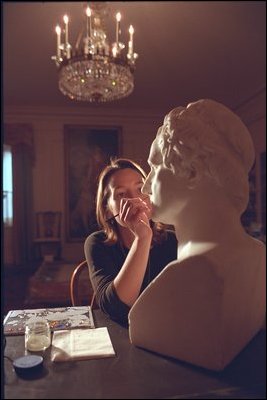 While working in the China Room, an artist preserves a bust.