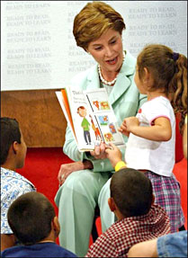 Laura Bush reads the book That's My Dog to students from the Clayton Center, a migrant Head Start Program, at the Raleigh Durham Airport in Raleigh, N.C.