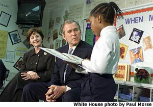 A student from St. Louis reads for President and Mrs. Bush. White House photo by Paul Morse.