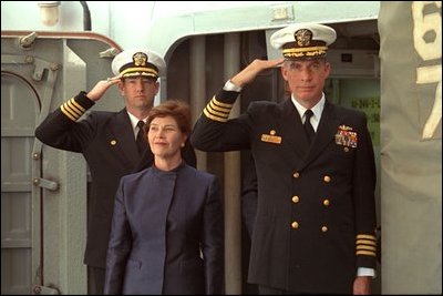 Laura Bush is saluted by Capt. Bob Liggett, right, as she boards the USS Shiloh stationed in San Diego Friday, March 23, 2001. White House photo by Paul Morse. 