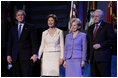 President George W. Bush stands with Laura Bush, Lynne Cheney and Vice President Dick Cheney during the pre-inaugural event “Saluting Those Who Serve” at the MCI Center in Washington, D.C., Tuesday Jan. 18, 2005. 