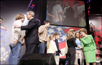 President George W. Bush and Laura Bush greet participants at the 'America's Future Rocks Today- A Call to Service' youth event at the DC Armory in Washington, D.C., Tuesday Jan. 18, 2005.