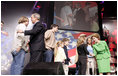 President George W. Bush and Laura Bush greet participants at the 'America's Future Rocks Today- A Call to Service' youth event at the DC Armory in Washington, D.C., Tuesday Jan. 18, 2005.