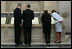 President George W. Bush and Laura Bush view the U.S. Constitution with National Archivist John Carlin, second on left, and Senior Curator Stacy Bredhoff, second on right, while touring the National Archives in Washington, D.C., Wednesday, Jan. 19, 2005. The Bushes also looked at the Declaration of Independence, George Washington's handwritten inaugural address, George Washington and President George H. W. Bush's inaugural Bible, and the Bill of Rights. 
