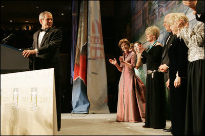 After an introduction by Vice President Dick Cheney, President George W. Bush talks at the Black Tie and Boots Inaugural Ball in Washington, D.C., Wednesday, Jan. 19, 2005. Also pictured are, from left, Jenna Bush, Barbara Bush, Laura Bush, Congresswoman Kay Granger, Vice President Cheney and Lynne Cheney. 