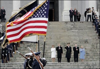 Escorted by Army Major General Galen Jackman, center, President George W. Bush, Laura Bush, Vice President Dick Cheney and Lynne Cheney salute the American flag from the U.S. Capitol steps before President Bush takes the oath of office for a second term as the 43rd President of the United States, Thursday, January 20, 2005.