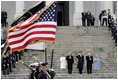 Escorted by Army Major General Galen Jackman, center, President George W. Bush, Laura Bush, Vice President Dick Cheney and Lynne Cheney salute the American flag from the U.S. Capitol steps before President Bush takes the oath of office for a second term as the 43rd President of the United States, Thursday, January 20, 2005.