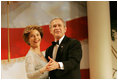 President George W. Bush and Laura Bush dance for the crowd during the Constitution Ball held at the Washington Hilton, Washington, D.C., Thursday, Jan. 20, 2005.