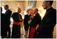 Laura Bush talks with American cardinals, archbishops and bishops during a reception at the Villa Taverna in Rome April 7, 2005.