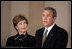 President George W. Bush gives remarks on the death of Pope John Paul II with First Lady Mrs. Laura Bush at the White House on Saturday April 2, 2005.