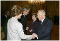 President George W. Bush and first lady Laura Bush are greeted upon their arrival to Quirinale Palace by Italy's President and first lady, Carlo and Franca Ciampi, Thursday, April 7, 2005. President and Mrs. Bush paid the courtesy visit while in Rome for the funeral of Pope John Paul II.