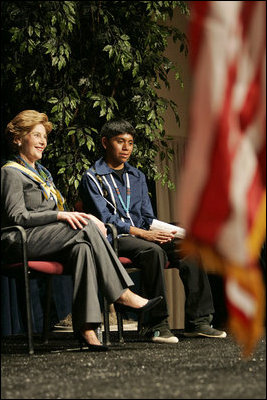Laura Bush sits with 16-year-old Derwin Tekala, a participant in the Red Road Youth Empowerment Project, before delivering remarks at the Heard Museum in Phoenix, Ariz., April 26, 2005. Mrs. Bush discussed the role of strong family and cultural bonds in helping children resist negative social pressures.