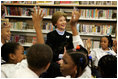 Laura Bush introduces her Scottish Terrier puppy Miss Beazley to fourth-grade students from Maury Elementary School during a visit to the Martin Luther King Jr. Memorial Library in Washington, D.C., Tuesday, April 12, 2005.